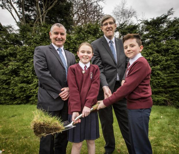 Principal John Gallagher, Education Minister John O'Dowd and pupils from St Bronagh's Primary School