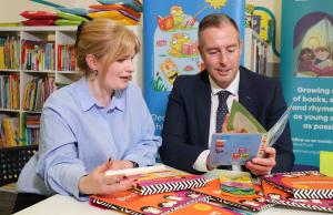 ducation Minister has welcomed the reintroduction of a programme designed to encourage shared reading.