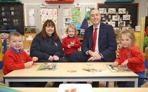 Minister with teacher and pupils at Jolly Pirates Pre School 