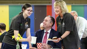 Photo of Education Minister Paul Givan with Fleming Fulton Head Girl Mary O’Neill and HE teacher Catherine Foster.